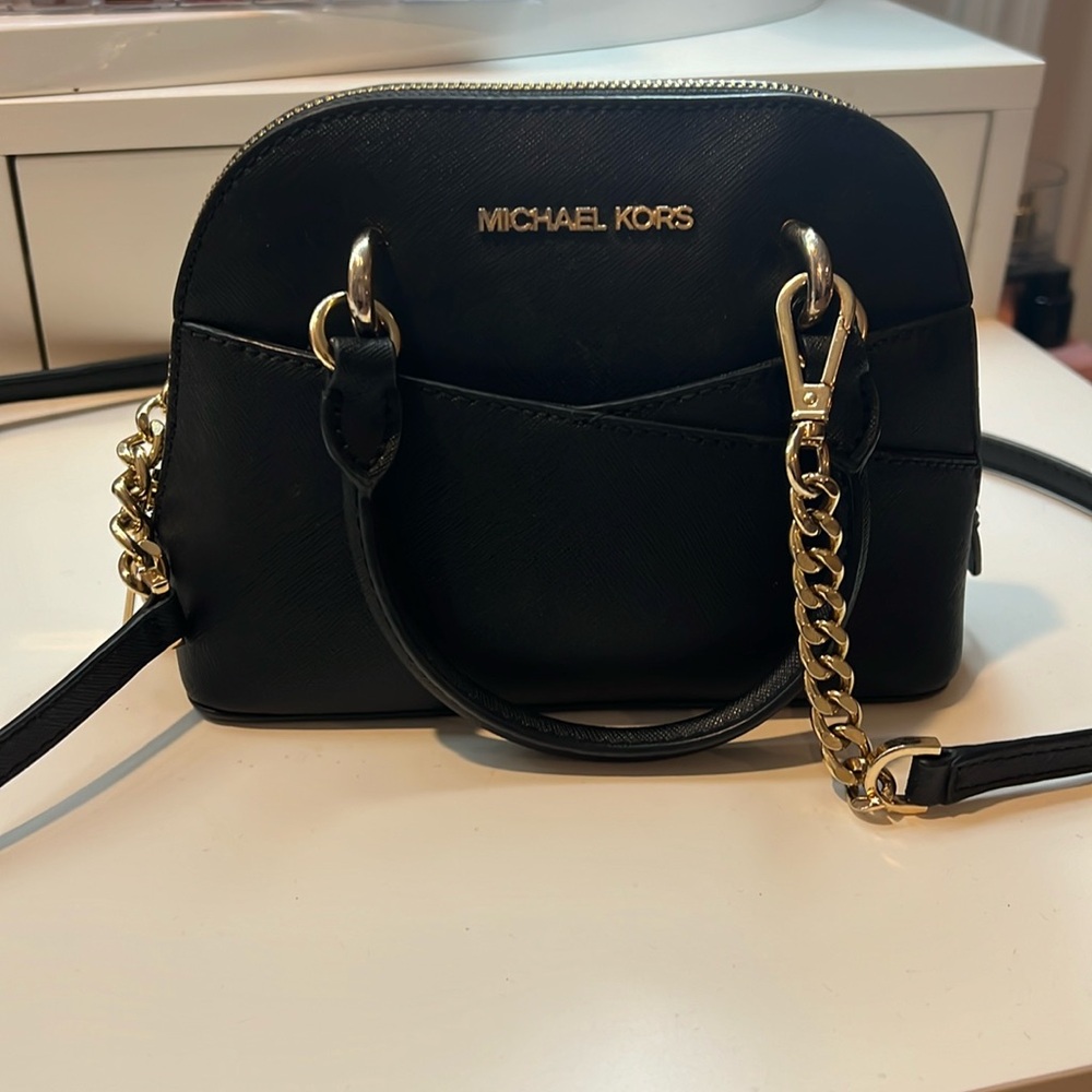 Mini Michael Kors crossbody bag.